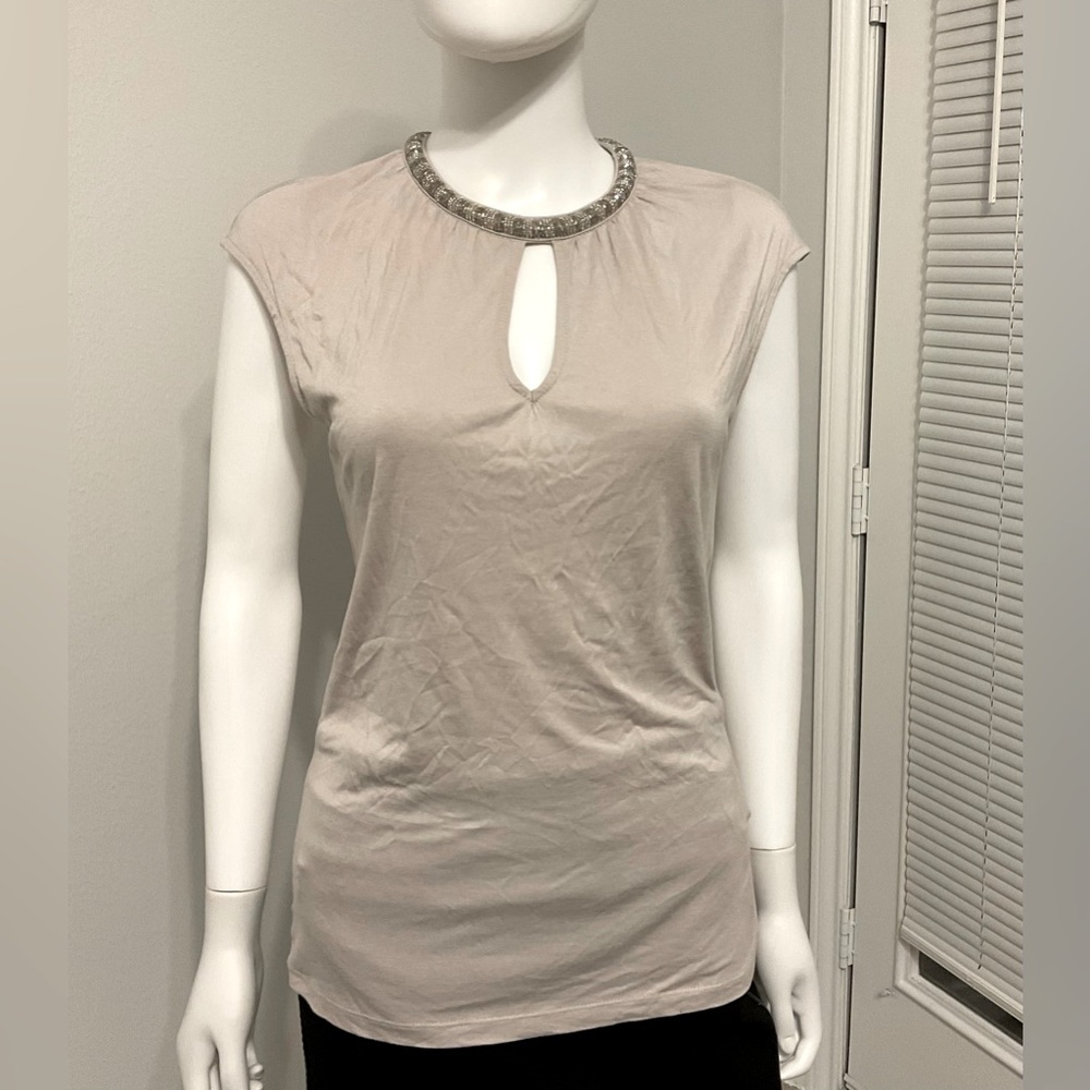 H&M beige top with beaded neckline.  It has a flirty keyhole on the chest. SZ-S